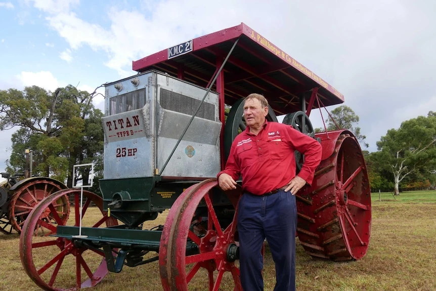 Bob Lukins stands next to a $190,000 tractor