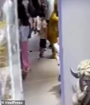 CCTV footage shows the boy leaning against the giant sculpture