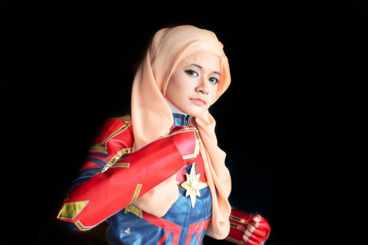 Superhero Costume: Ange tried to find characters that would suit her facial contours so she didn't have to wear too much makeup, like this Captain Marvel stand up.  (Personal collection/Courtesy of Ange Minami)