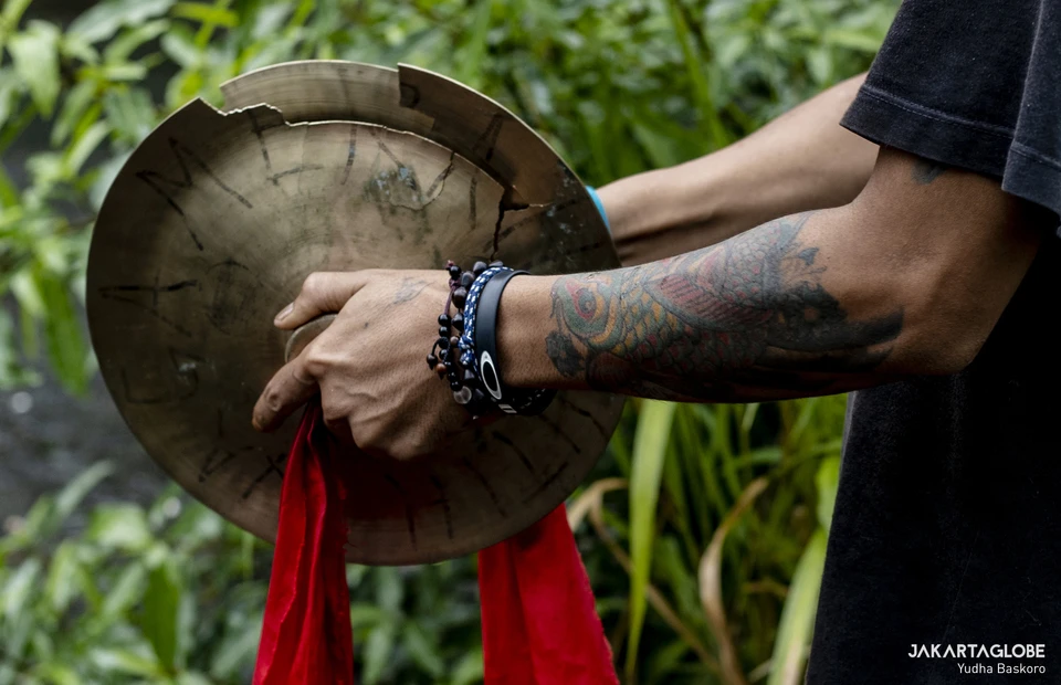 A man plays a small cymbal during practice at the Naga Merah Putih headquarters in Bogor, West Java, Jan. 15, 2022. (JG Photo/Yudha Baskoro)