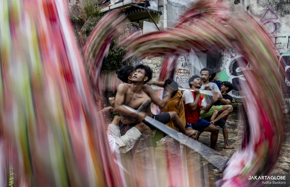 Dancers perform a Liong (dragon) dance during a practice at the Naga Merah Putih headquarters in Bogor, West Java, January 15, 2022. (JG Photo/Yudha Baskoro)