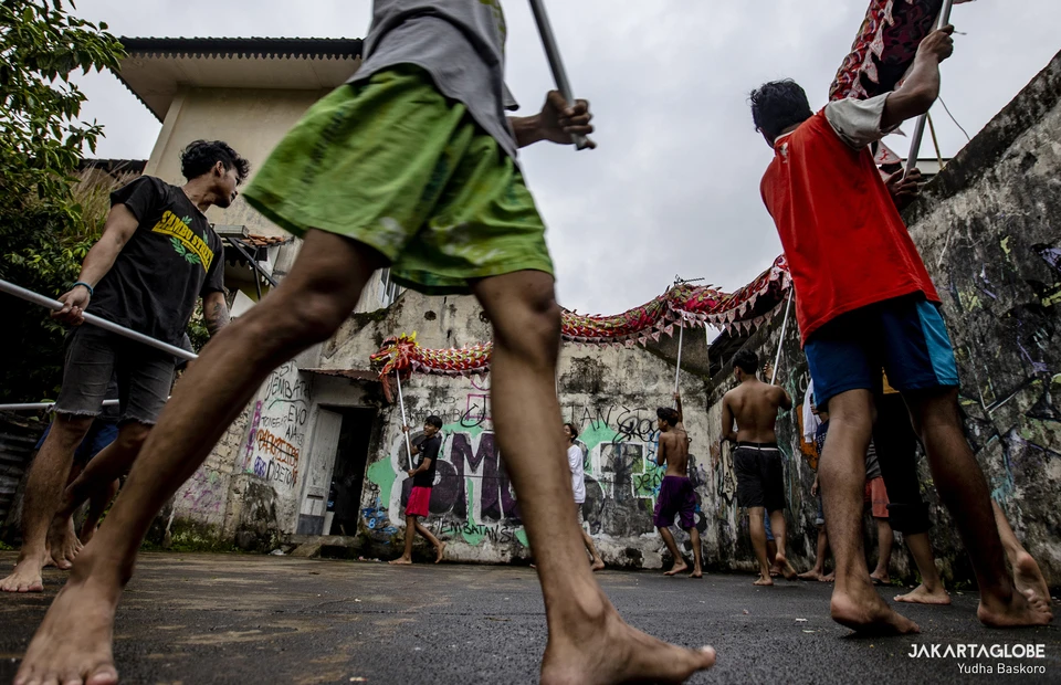 Dancers perform a Liong (dragon dance) during a practice at the Naga Merah Putih headquarters in Bogor, West Java, January 15, 2022. (JG Photo/Yudha Baskoro)