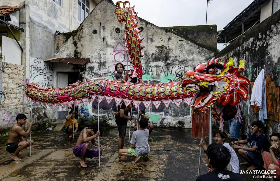 Dancers pose with the Liong during a practice at the Naga Merah Putih headquarters in Bogor, West Java, January 15, 2022. (JG Photo/Yudha Baskoro)
