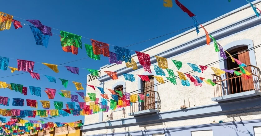 Festive colorful banners on a street in Todos Santos.