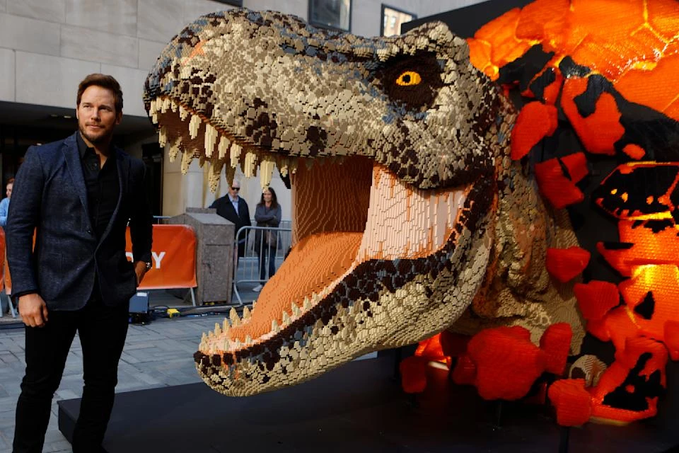 Chris Pratt unveils a life-size LEGO Jurassic World Dominion T. rex sculpture on the Today show. (Photo by Jason DeCrow/Invision for NBCUniversal and LEGO/AP Images)