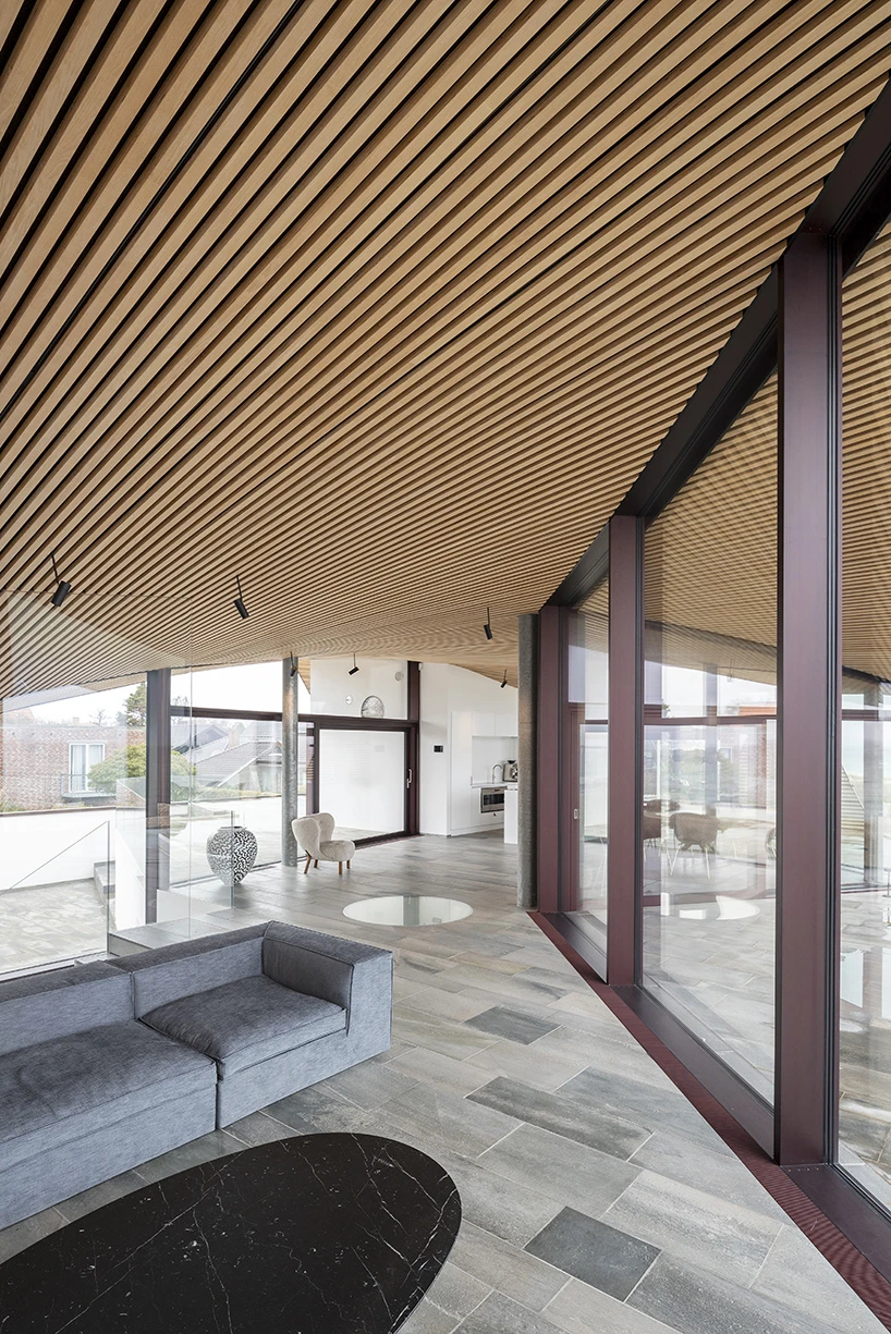 CEBRA forms a Danish seaside villa as an angular living sculpture with a wavy roof