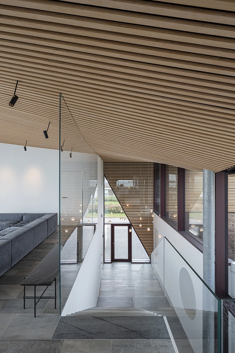 CEBRA forms a Danish seaside villa as an angular living sculpture with a wavy roof