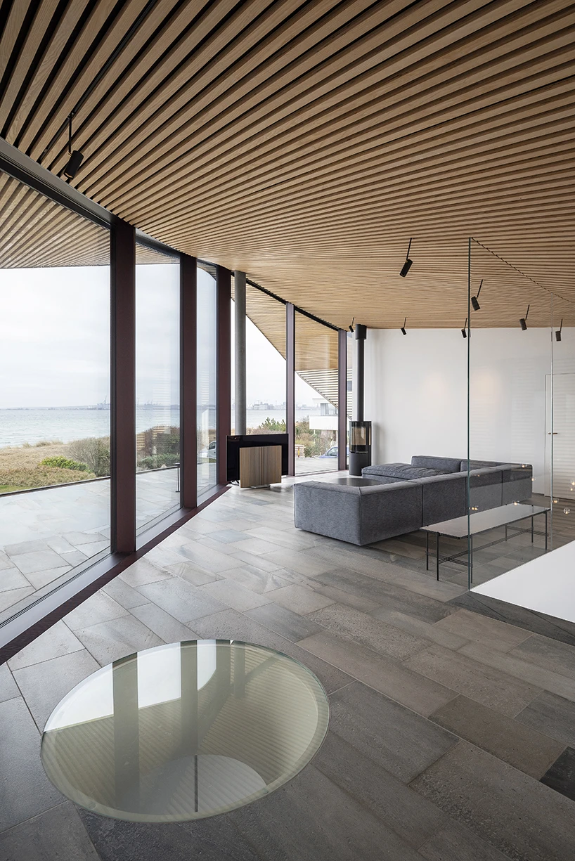 CEBRA forms a Danish seaside villa as an angular living sculpture with a wavy roof