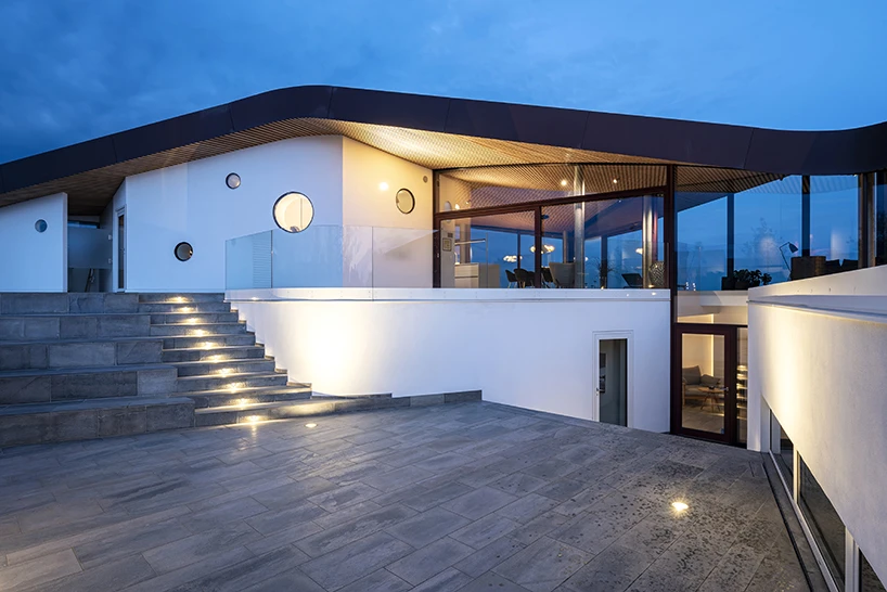 CEBRA forms a Danish seaside villa as an angular living sculpture with a wavy roof