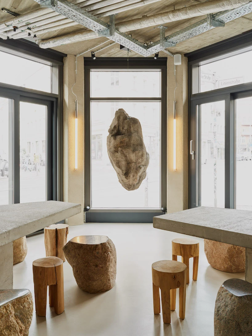 The earthy and intimate design of the VAUST studio of the poke restaurant in berlin pays homage to the culture of the fishermen