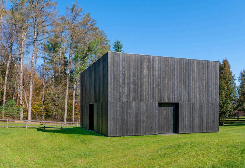 OLI Architecture places Richard Serra's London Cross sculpture in charred wooden pavilion in New York City