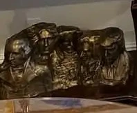 The sculpture adds Trump's face as the fifth head on the famous monument